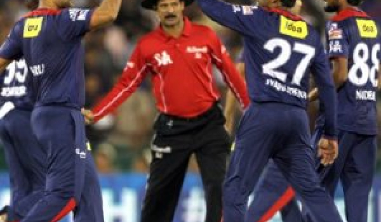 Delhi Daredevils crushed Pune Warriors India by 15 runs lifting itself from the bottom