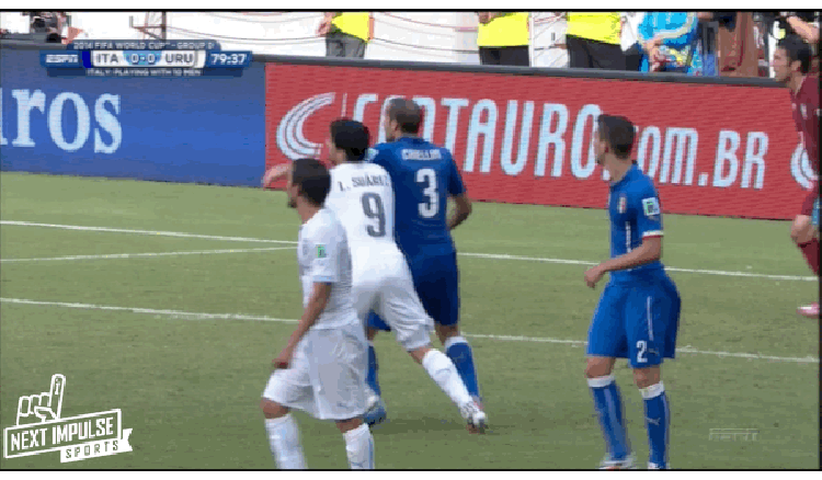 Suarez appears to bite Italy defender